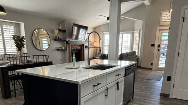 A spacious kitchen with a large island, modern appliances, and a high ceiling with recessed lighting. - Stylish Escape/3BDRM & fireplace (El Paso)