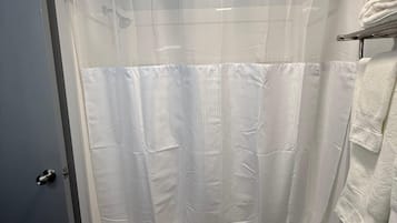 Bathtub, hair dryer, towels, soap