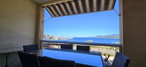 Enjoy breathtaking views of the marina and sea from this balcony.