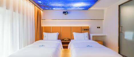 A hotel room with two beds, a starry ceiling design, and a view of the night sky.