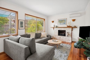 TV, fireplace - Retro Family Home Perfect for Coastal Getaway (Ocean Grove)