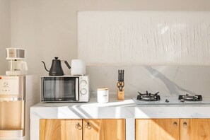 Fridge, microwave, stovetop, coffee/tea maker