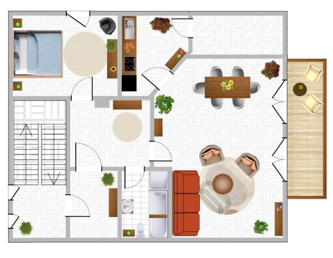 Ein Hotelzimmer mit Bett, Sitzecke, Küchenzeile und kleinem Balkon.