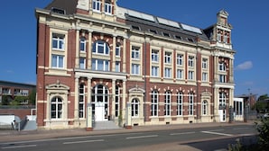 A large, historic building with multiple windows and a prominent entrance. - Bendix weaving mill, apartment, 1-3 persons (Dülmen)