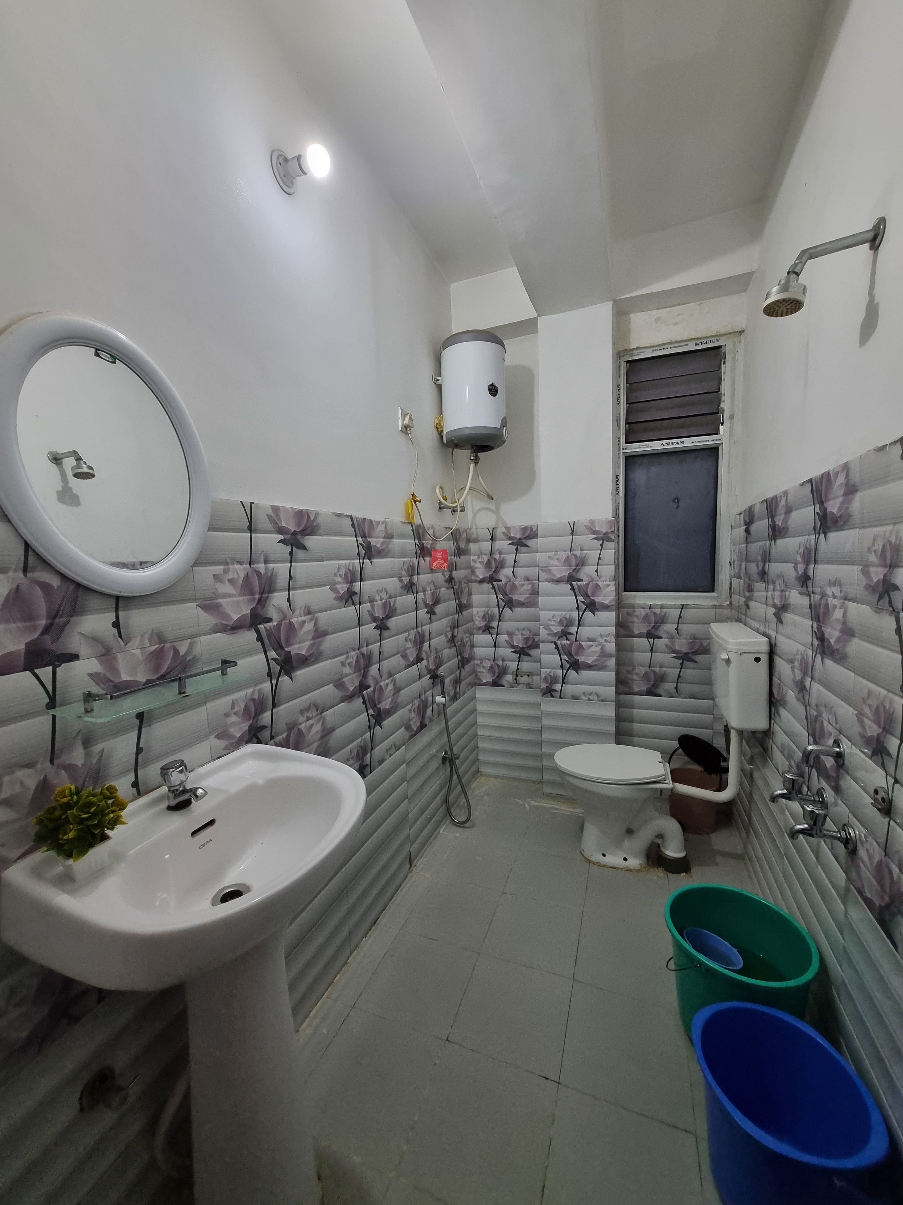 A bathroom with a sink, toilet, and shower.