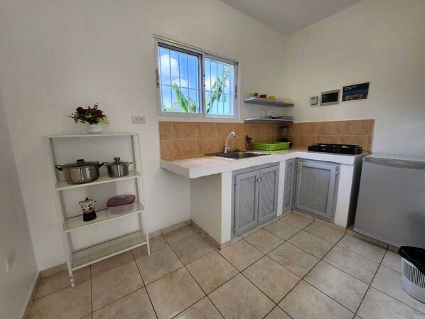 Fridge, stovetop, coffee/tea maker, cookware/dishes/utensils