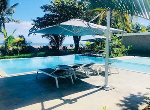 Outdoor pool, pool umbrellas, sun loungers