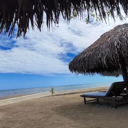 On the beach, sun loungers, beach umbrellas, beach towels