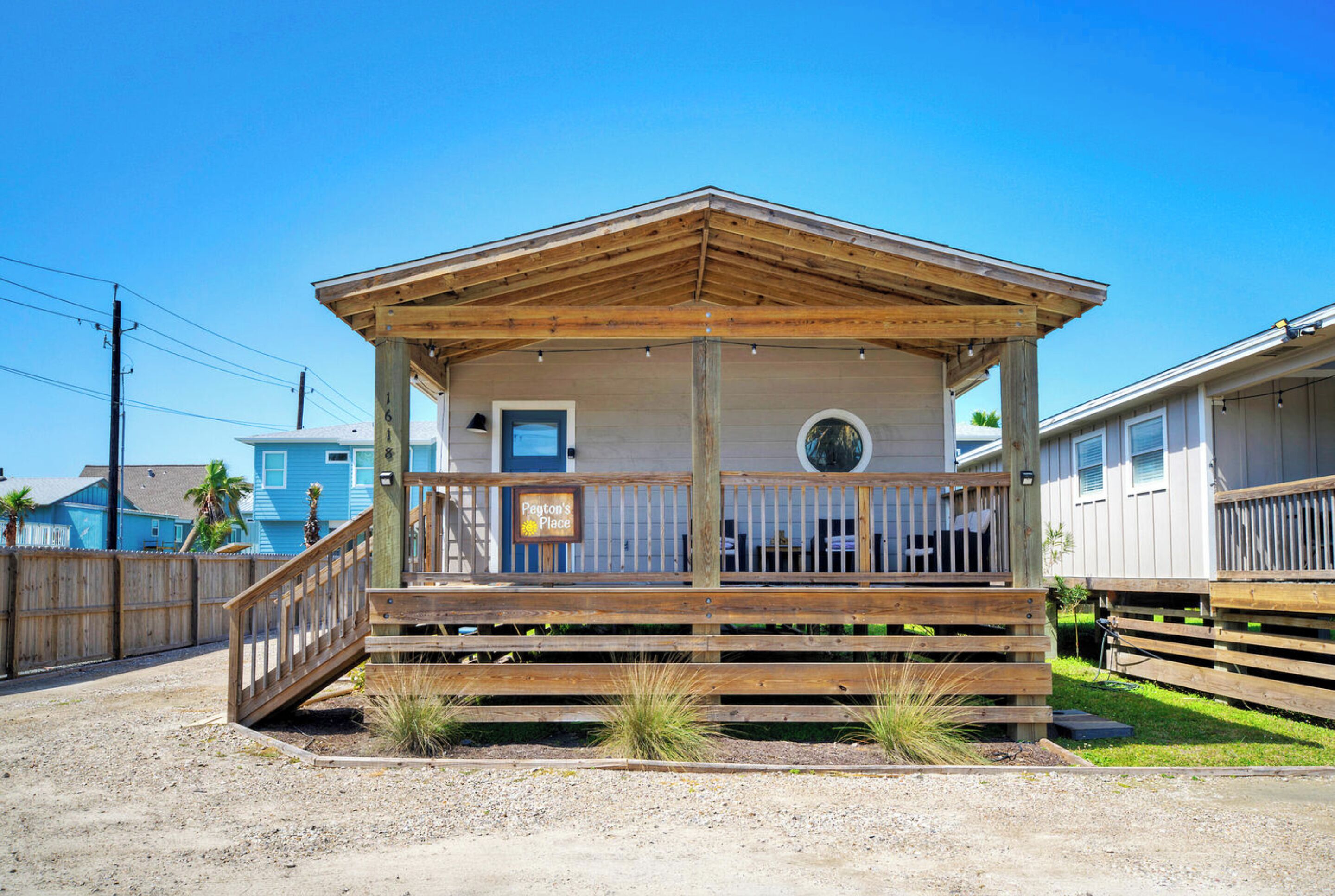 A wooden cabin with a porch, a small window, and a sign that reads "Payton's Place".
