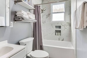 Shower, hair dryer, towels