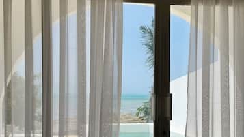 Luxury Suite, Patio, Beach View | 1 bedroom, desk, iron/ironing board, free WiFi