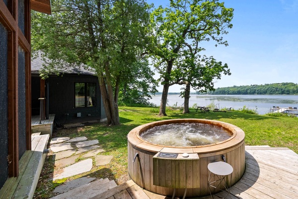Soak away stress in the private cedar hot tub while enjoying panoramic views of Lake Wandawega. This backyard oasis is the perfect spot to unwind after a day of kayaking.