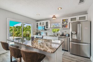 House, Multiple Beds, Pool Access, Garden View (The Tampa Oasis) | Private kitchen | Fridge, microwave, oven, stovetop - The Tampa Oasis (Tampa)