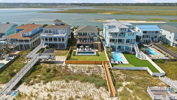 A coastal hotel with multiple buildings, a central pool, and a beach access walkway. - Shell Yeah- Ocean Isle Beach (Ocean Isle Beach)