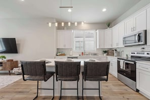 Fridge, microwave, oven, stovetop - New Luxury Home • King Bed • Garage (Youngsville)