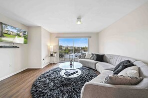 Condo, 1 Queen Bed, Balcony (The Urban Oasis) | Living area