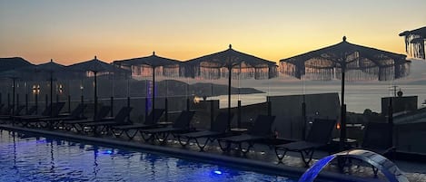 Indoor pool, seasonal outdoor pool, pool umbrellas, sun loungers