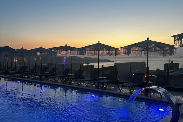 Indoor pool, seasonal outdoor pool, pool umbrellas, sun loungers