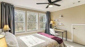 A bedroom with a bed, desk, chair, and large windows. - Game Day Base! 1 Mi to Ole Miss & Downtown (Oxford)