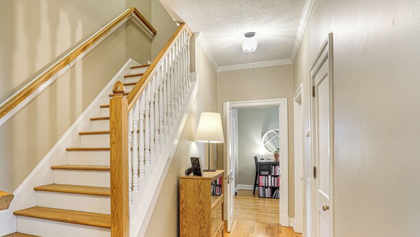 A staircase with wooden steps and white railings, leading to a room with a lamp and a bookshelf. - Game Day Base! 1 Mi to Ole Miss & Downtown (Oxford)