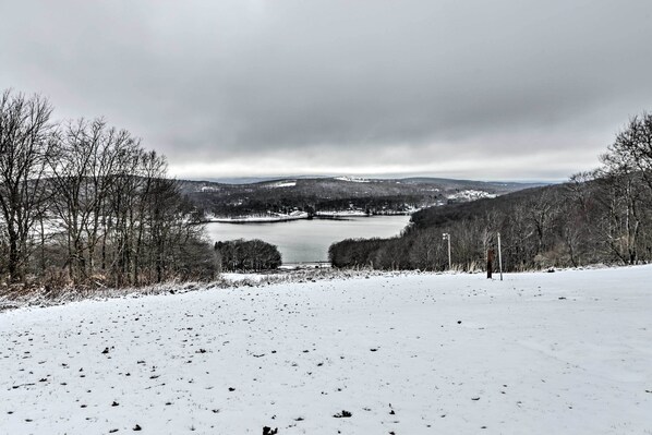 A snowy landscape with a lake, trees, and distant hills. - Hike, Ski & Raft: Terra Alta Cabin w/ Large Deck (Terra Alta)