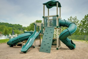 A playground with two slides and a climbing wall. - Spacious Modern Home ~ 1 Mi to Camelback Mountain! (Tannersville)