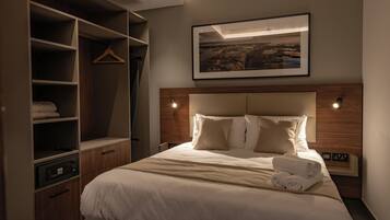 Deluxe Suite, Balcony | In-room safe, desk, laptop workspace, blackout curtains