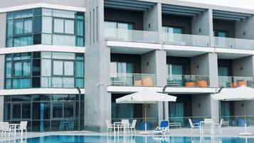 Outdoor pool, open 9:00 AM to 6:00 PM, pool umbrellas, sun loungers