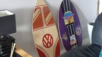 Two surfboards against a wall.