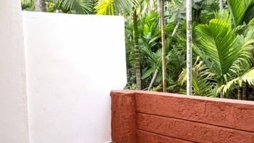 Deluxe Room, Garden View | Terrace/patio