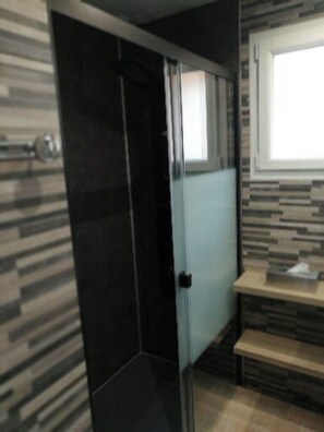 Shower, hair dryer, towels, toilet paper