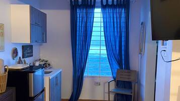 Fridge, microwave, stovetop, coffee/tea maker