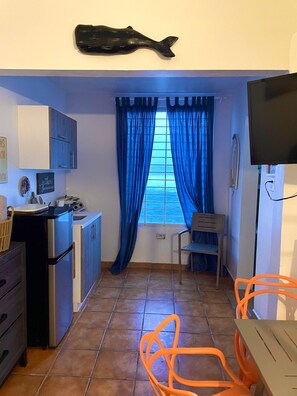 Fridge, microwave, stovetop, coffee/tea maker