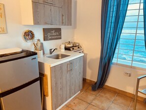 Fridge, microwave, stovetop, coffee/tea maker