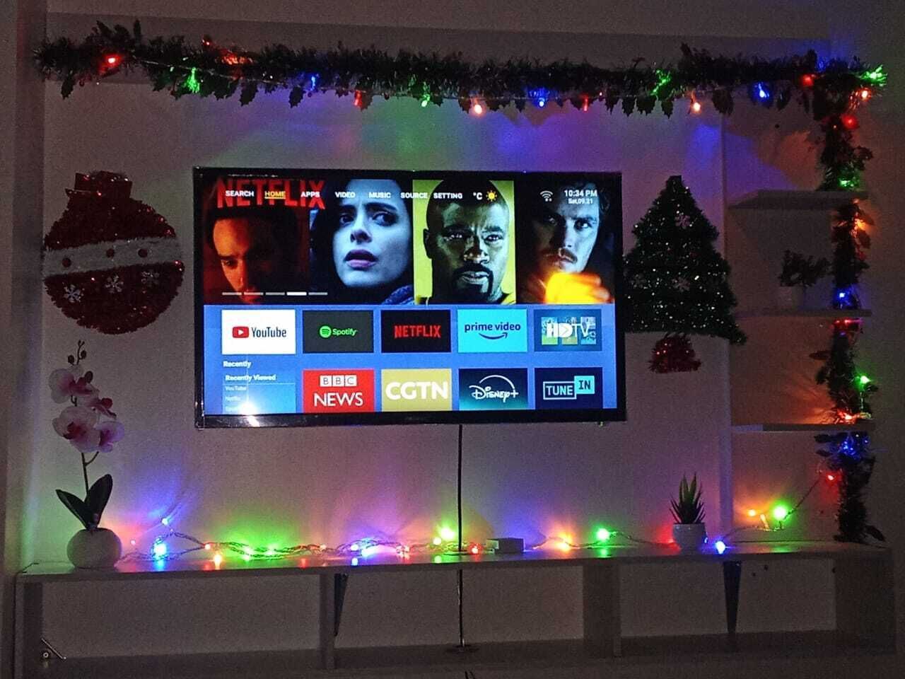 A television displaying various streaming service logos.