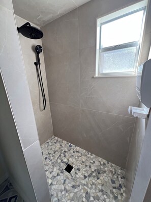 Shower, hair dryer, towels, soap