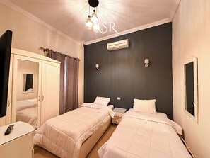 2 habitaciones, tabla de planchar con plancha, wifi y ropa de cama 