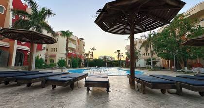 Exclusive apartment with private garden area and big swimming pool