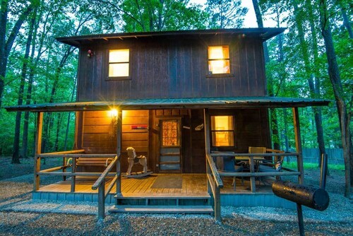 Beau Cabin is a two-story cabin with an open kitchen/living area downstairs and a shared bedroom that sleeps up to four people on the second floor.<br>Pet Friendly, additional $15 per night per pet charge.
