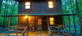 Beau Cabin is a two-story cabin with an open kitchen/living area downstairs and a shared bedroom that sleeps up to four people on the second floor.<br>Pet Friendly, additional $15 per night per pet charge.