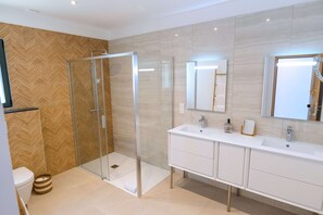 Shower, hair dryer, towels, toilet paper