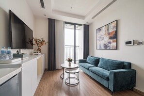 Apartment, 2 Bedrooms | Living area | 50-inch TV with cable channels - Sunny - Vinhomes GreenBay Residences (Hanoi)