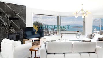 Villa, Sea View | Living area | Flat-screen TV