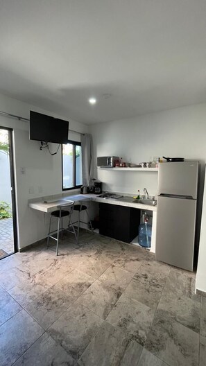 Fridge, microwave, stovetop, coffee/tea maker