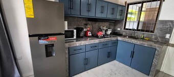 New 2 bdr beach house with WIFI, BBQ and secure carport. Relax in style.