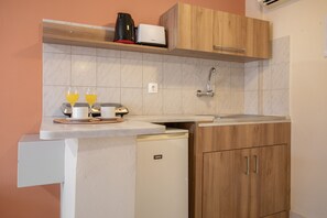 Fridge, stovetop, electric kettle, toaster