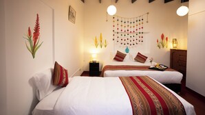 A hotel room with two beds, a hanging decoration, and a wooden ceiling. - KUSKA SAN BLAS (Cusco)