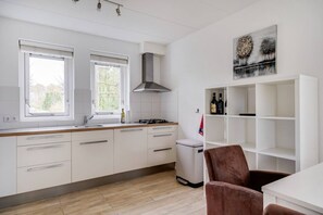 Fridge, stovetop, coffee/tea maker, dining tables