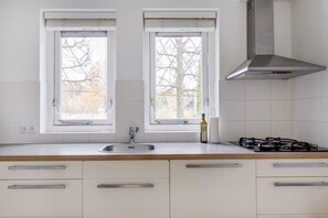 Fridge, stovetop, coffee/tea maker, dining tables