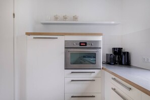 Fridge, stovetop, coffee/tea maker, dining tables